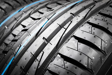 Car tire. Tire stack. Car tyre protector close up. Black rubber tire. Brand new car tires. Close up...