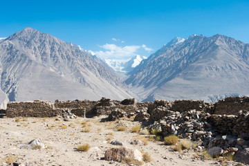 Pamir Mountains, Tajikistan - Aug 22 2018: Ruins of Yamchun Fort in the Wakhan Valley in Gorno-Badakhshan, Tajikistan. It is located in the Tajikistan and Afghanistan border.