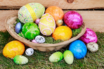 Traditional Easter basket with colorful eggs.