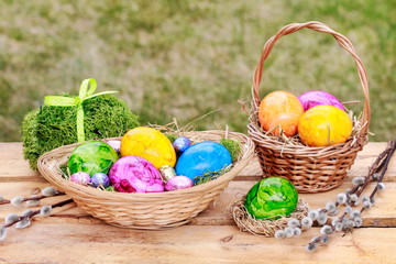 Traditional Easter basket with colorful eggs.