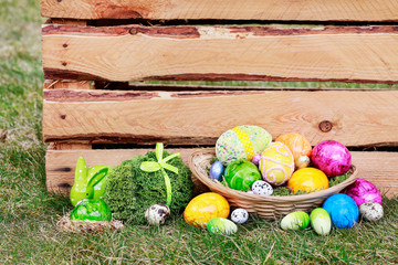 Traditional Easter basket with colorful eggs.