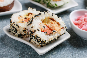 Sushi set on grey stone background.