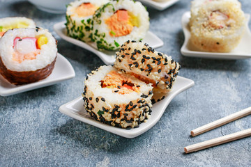 Sushi set on grey stone background.