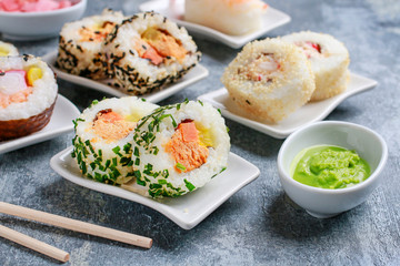 Sushi set on grey stone background.
