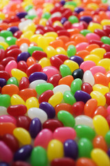 Fototapeta na wymiar Lots of jellybeans, colorful jelly beans background