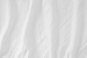 Fototapeta premium Close up of bedding White sheets with copy space.