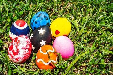 colored Easter eggs on the grass