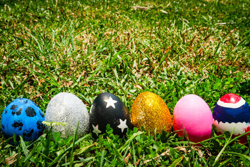 colored Easter eggs on the grass