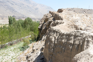 Ishkashim, Tajikistan - Aug 23 2018: Ruins of Khaakha Fortress in the Wakhan Valley in Ishkashim, Gorno-Badakhshan, Tajikistan. It is located in the Tajikistan and Afghanistan border.