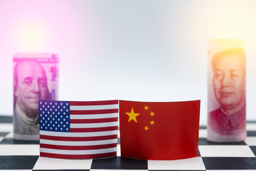 USA dollar and China Yuan banknote  on chess table. Its is symbol for tariff trade war crisis or unfair business of 2 biggest economic countries in the world.