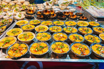 Street food at night in Phu Quoc island in Vietnam | Delicious seafood for tourist at market