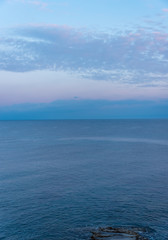 Obraz premium Mirror Still Mediterranean Sea on the Southern Italian Coast at Sunrise