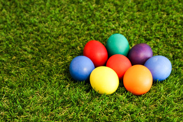 circle of easter eggs in green grass