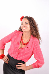 young girl with a red necklace, bracelet, hairpin on a white background.