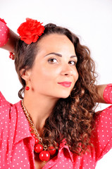 young girl with a red necklace, bracelet, hairpin on a white background.