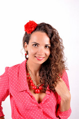 young girl with a red necklace, bracelet, hairpin on a white background.