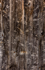 Obraz premium The look of a wooden wall from the boards, a beautiful texture, a village.
