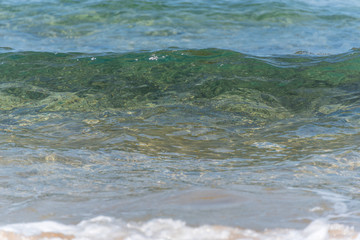 Waves Washing Ashore on a Mediterranean Beach