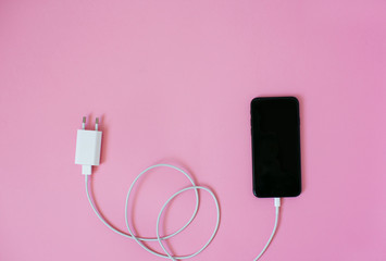 Top view of a smartphone with charge.
