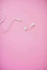 Headphones on pastel background.