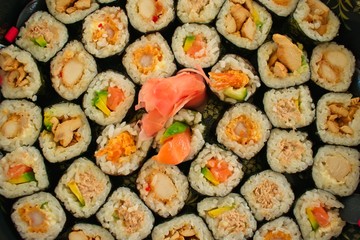 Sushi rolls ready to eat on a plate.