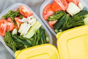 Closeup of delicious fresh raw vegetables from the garden in two containers, top view