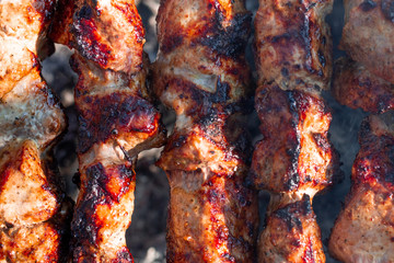 Delicious meat is fried on the grill