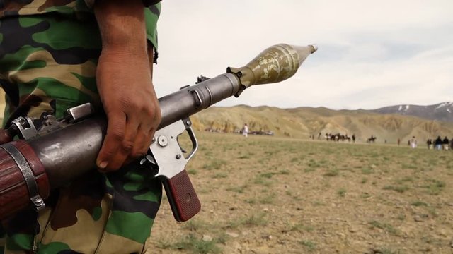 Horse mounted games played in Afghanistan are Buzkhazi, kokpar, kupkari and ulak tartysh. Over the shoulder.