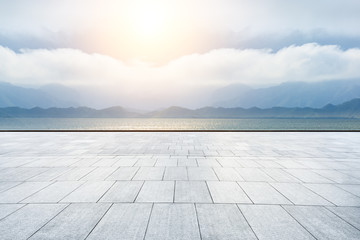 Empty square platform and river with mountain landscape