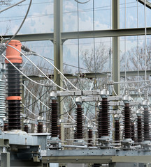 Naklejka premium detail view of transformers and conduits at an electric power station