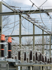 detail view of transformers and conduits at an electric power station