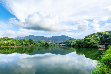 Naklejka na ściany i meble Green mountain and calm lake natural scenery in Hangzhou