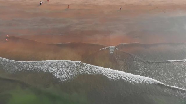 Shooting from the drone of the Arambol beach with tidal waves. Goa State. India.