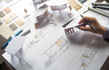 architect design working drawing sketch plans blueprints and making architectural construction...