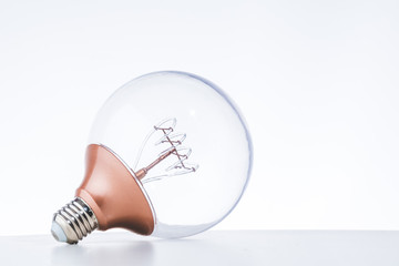 LED bulb on the white table with white background for eco saving