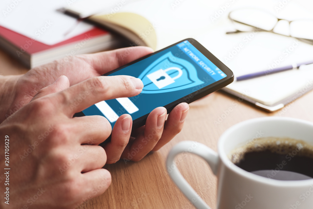Poster smartphone security system and protection app.closeup of male hands touching smartphone screen at ta