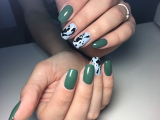 trendy green manicure on a textural