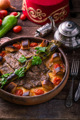 Spicy minced meat kebab with pepper and bread