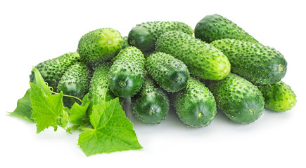 heap of fresh cucumbers on white background