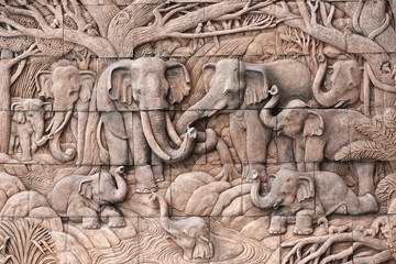 Elephant carved in stone on the temple wall in Thailand