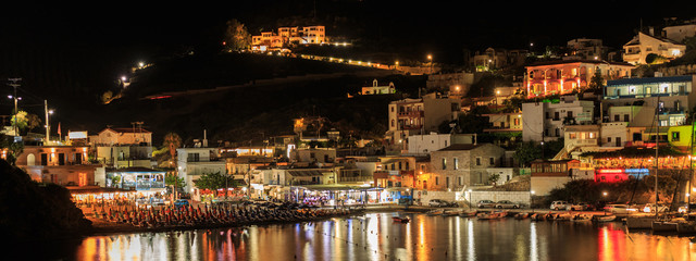 Fototapeta premium Bali village at night, Crete, Greece