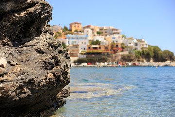 Fototapeta na wymiar Mediterranean sea coast. Calm clear water, rocks. Sunny day. Closeup