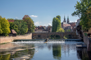 Fototapeta na wymiar Picturesque view of river Pegnitz in Nuremberg with water reflections.