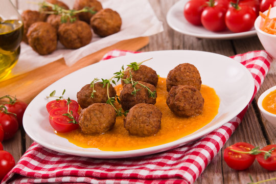 Meatballs with mashed carrots.