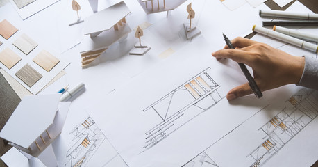 architect design working drawing sketch plans blueprints and making architectural construction...