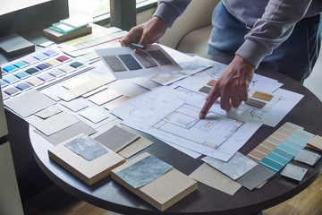 Architect designer Interior creative working hand drawing sketch plan blue print selection material color samples art tools Design Studio