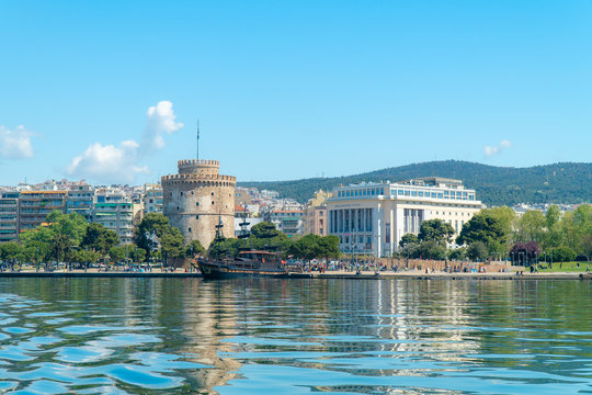 Thessaloniki / Greece 11 April 2019  the blue sea and the  white tower of thessaloniki city's symbol and landmark ,beautiful sunny day after long time of rain and clouds great opportunity for a walk.