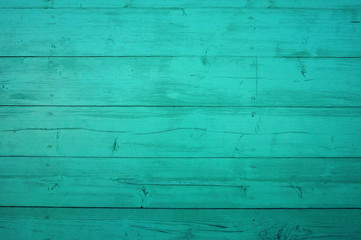Obraz premium Background from old shabby wooden boards. Turquoise wood texture with peeling paint
