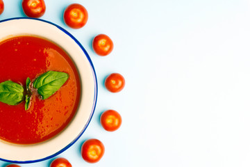 Gazpacho cold summer vegetarian tomato soup with basil in a bowl