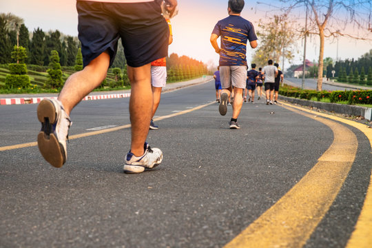 Group of people exercise runing at the park in evening - Image